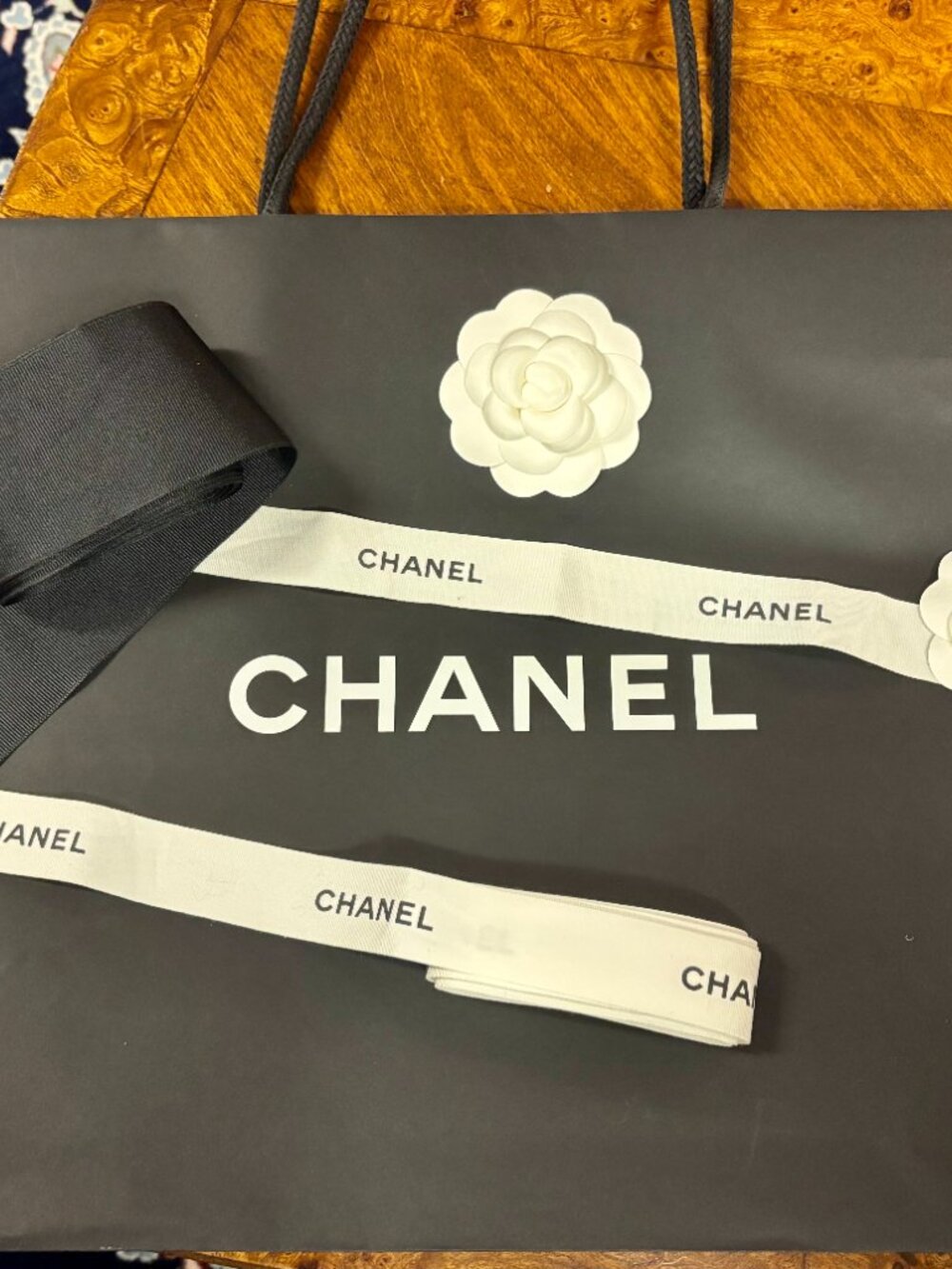 Chanel Shopping Bag with White Flower Accent and Ribbons